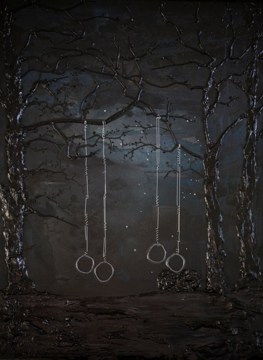 four-tire-swing-in-dark-driveway